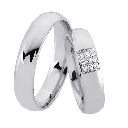 Smukke Nuran vielsesringe i rhodineret sterlingsølv med 9 diamanter i klassisk og tidløst design.